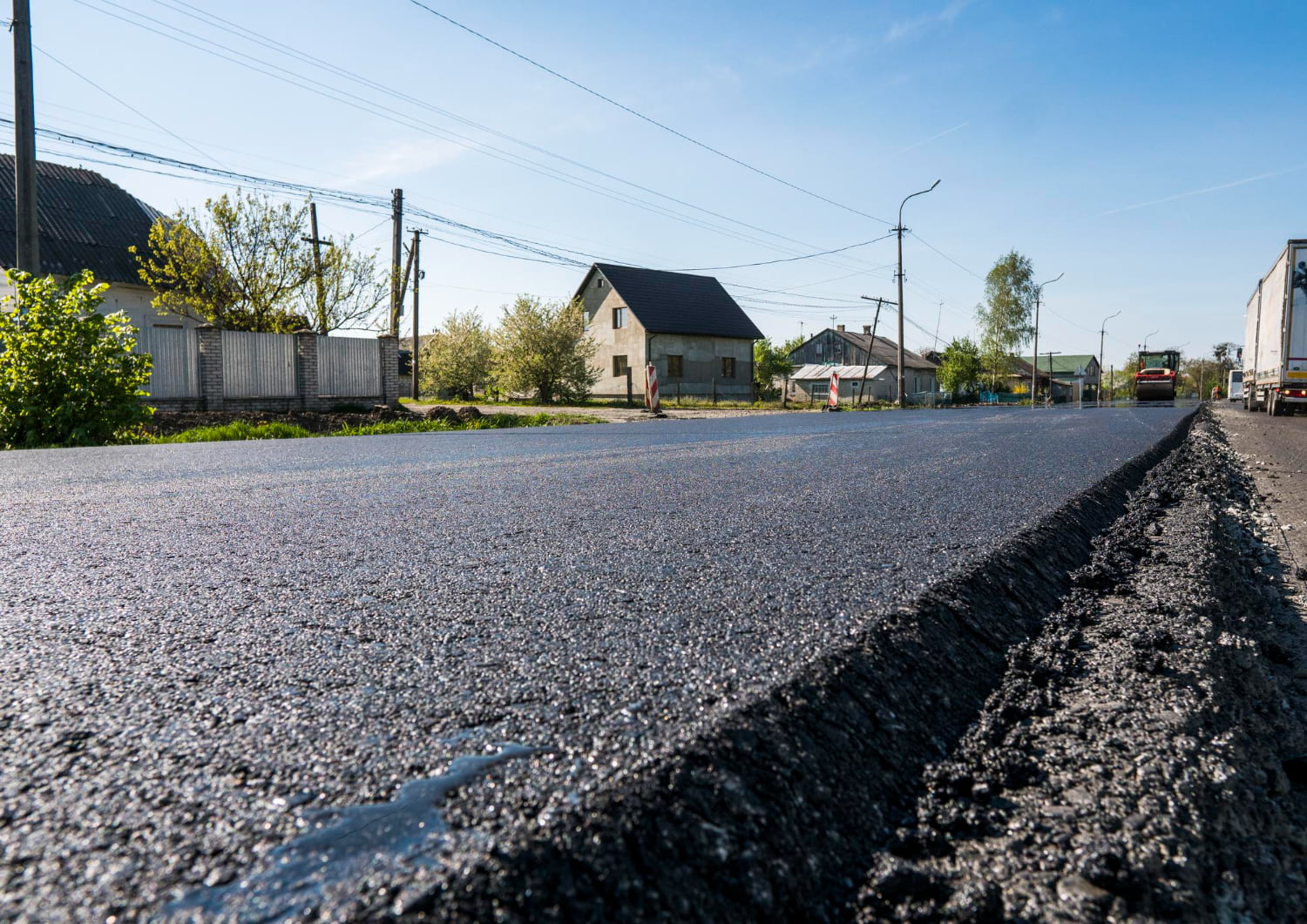 freshly-laid-black-bitumen-asphalt-with-high-edge-gravel-showing-structure Asphalt Maintenance
