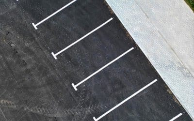 The Small Cracks That Cost Big: Why Parking Lot Repairs Can’t Wait